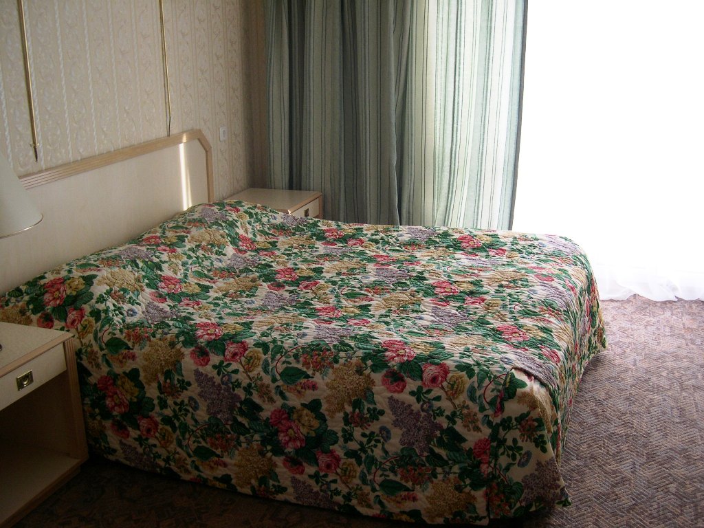 Спальня в номере люкс в гостинице Спортотель 2 