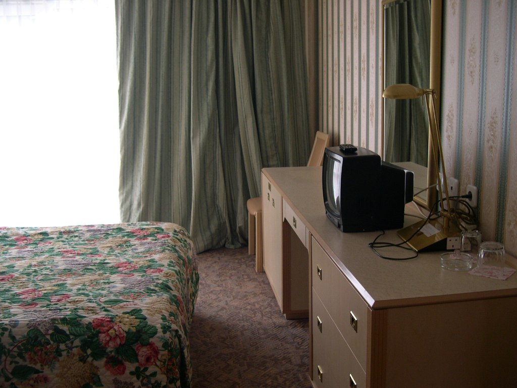 В спальне в номере люкс в гостинице Спортотель 2 